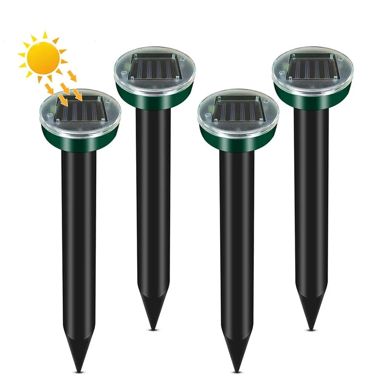 A black solar ultrasonic pest repeller device with a green top and conical base.