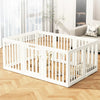 White indoor pet playpen with a wooden floor and vertical slats, shown in a modern living room setting.