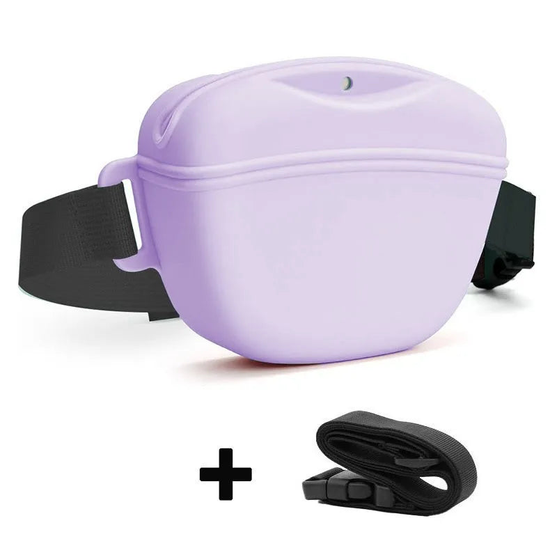 A purple silicone dog treat pouch attached to a black belt clip.