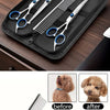 A set of professional stainless steel pet grooming scissors and a comb displayed in a black case.