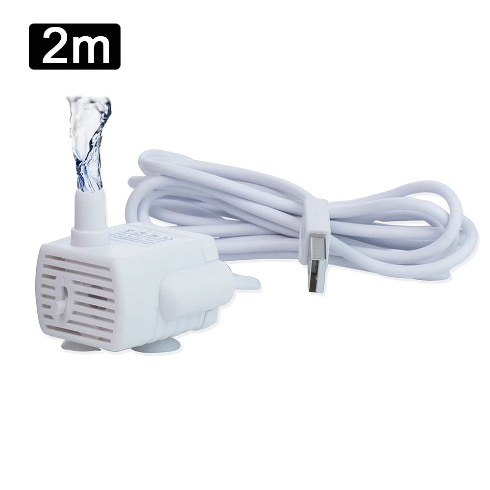 A white pet fountain water pump with a clear tube and a white electrical cord is shown.