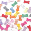 A close-up of multi-colored dog hair clips in various pastel and bright colors scattered on a white background.