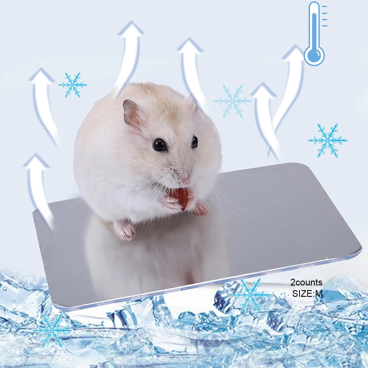 A fluffy white hamster is resting on a silver aluminum cooling pad with ice snowflake graphics.
