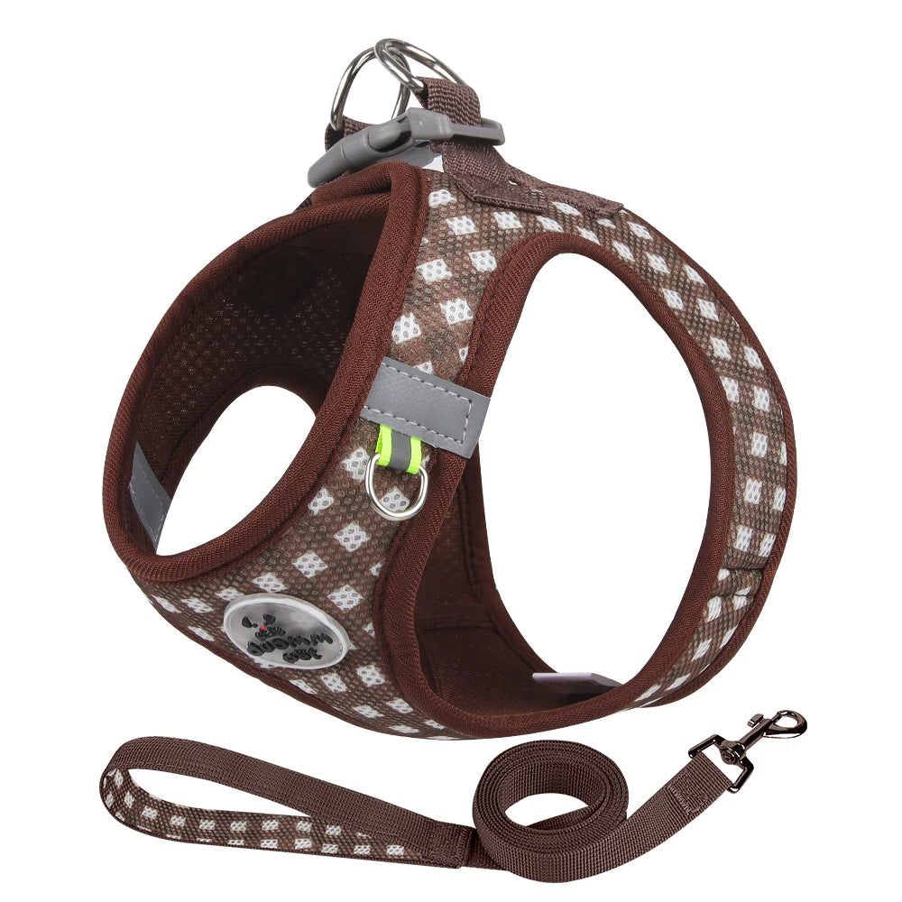 A brown plaid pet harness with reflective strips is shown, along with a separate leash.