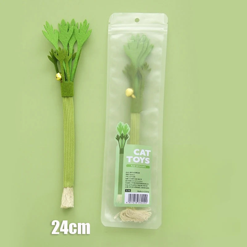 A green catnip celery chew toy with a bell is displayed in a clear plastic pouch.