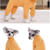 An orange thermal fleece dog jumpsuit for winter warmth, shown in a standing and lying pose.