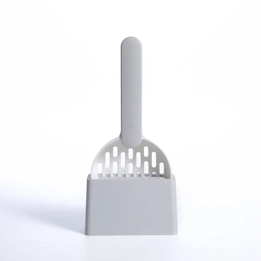A white cat litter scoop and cleaning brush set with a handle and a flat scooping surface.