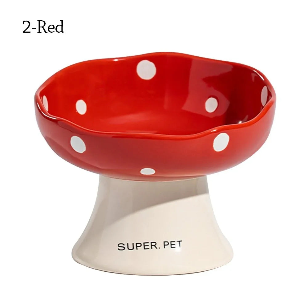 A red ceramic pet bowl with white polka dots on the rim and a beige base.