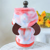 A plush fleece pet overalls for dogs and cats in pink and white with brown accents.
