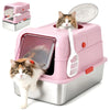 A pink stainless steel enclosed litter box for cats with a tabby kitten looking out of the opening.