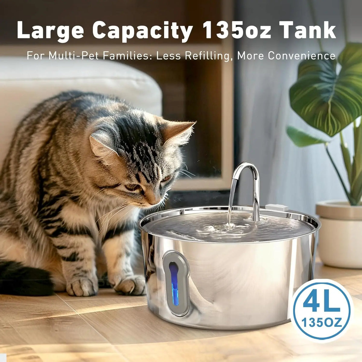 A stainless steel automatic cat water fountain with water flowing, placed on a wooden surface next to a tabby cat.