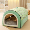 A light green pet bed shaped like a dome with an arched entrance and a fuzzy interior for dogs and cats