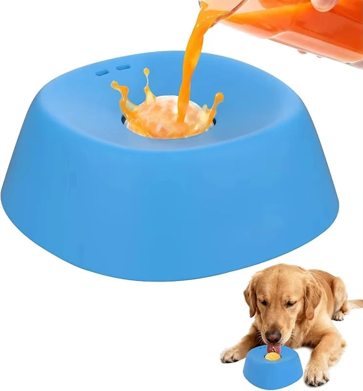 A dog is eating food from an orange liquid being poured into a blue ergonomic slow feeder bowl.