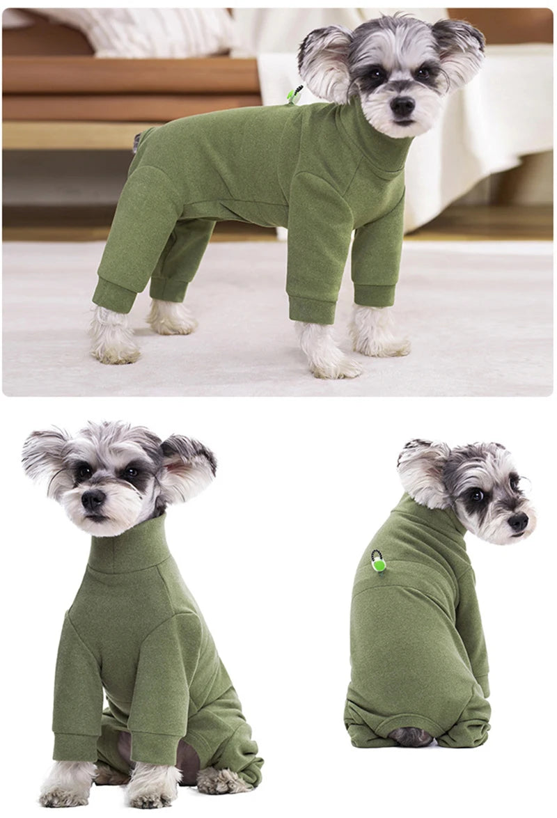 A fluffy grey dog wearing a olive green thermal fleece jumpsuit for winter warmth.