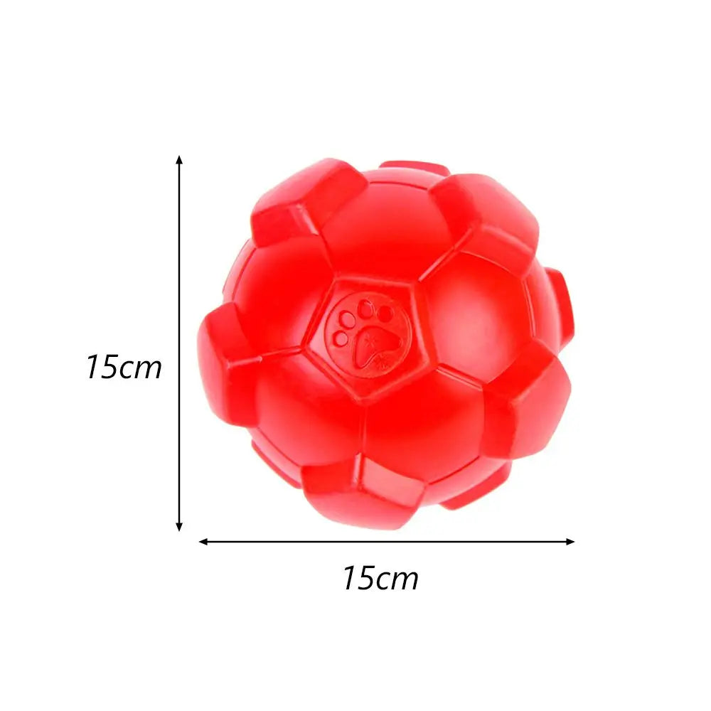A bright red hexagonal TPR dog chew toy with a paw print molded into the surface.