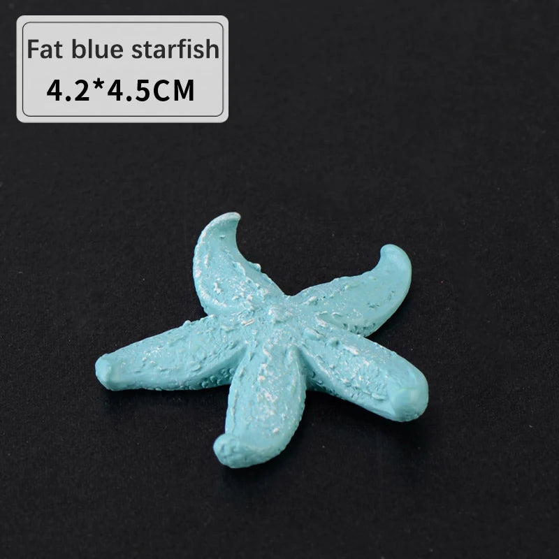 A light blue starfish decoration, measuring 4.2x4.5 cm, is shown on a dark background.