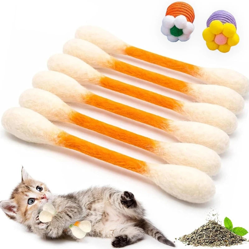 A pack of six orange and white felt chew sticks infused with catnip next to a kitten.