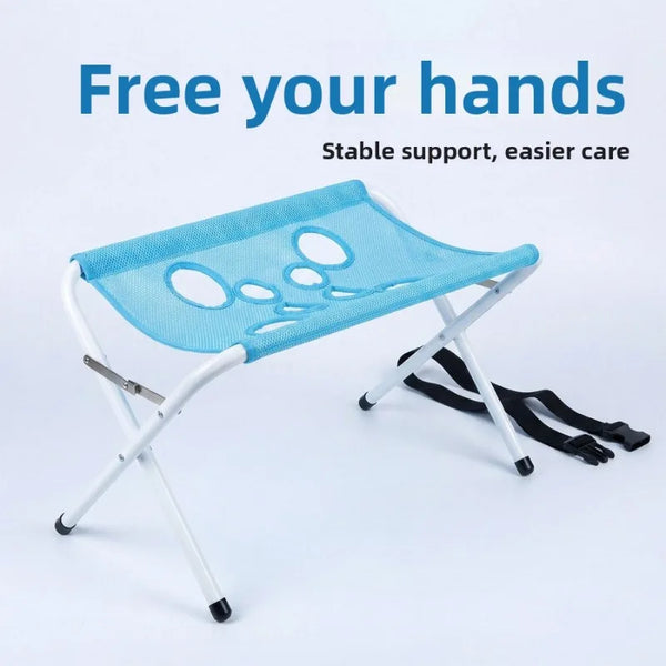 Light blue foldable pet bathing stand with a mesh tray and white frame for stable support.