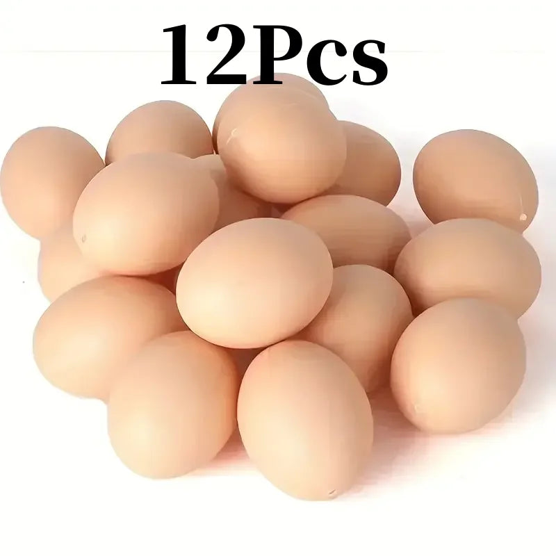 A pile of 12 realistic plastic chicken eggs for nesting boxes.