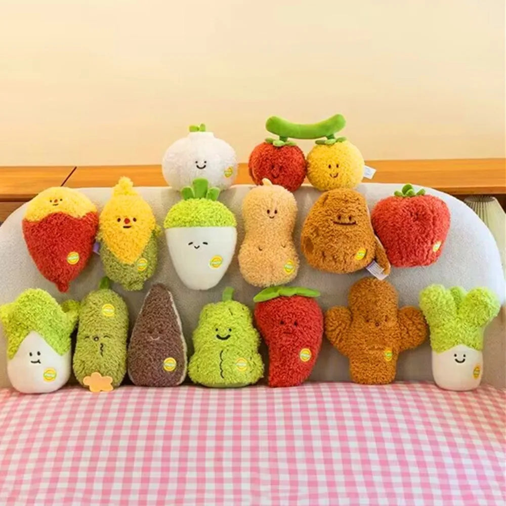 A collection of soft plush vegetable dolls including a pumpkin, squash, broccoli, and various green and orange vegetables.