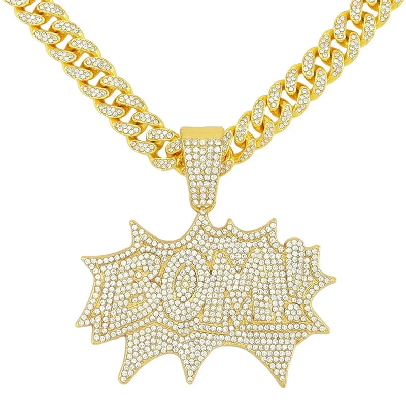 A gold iced out letter and animal pendant Cuban link chain necklace
