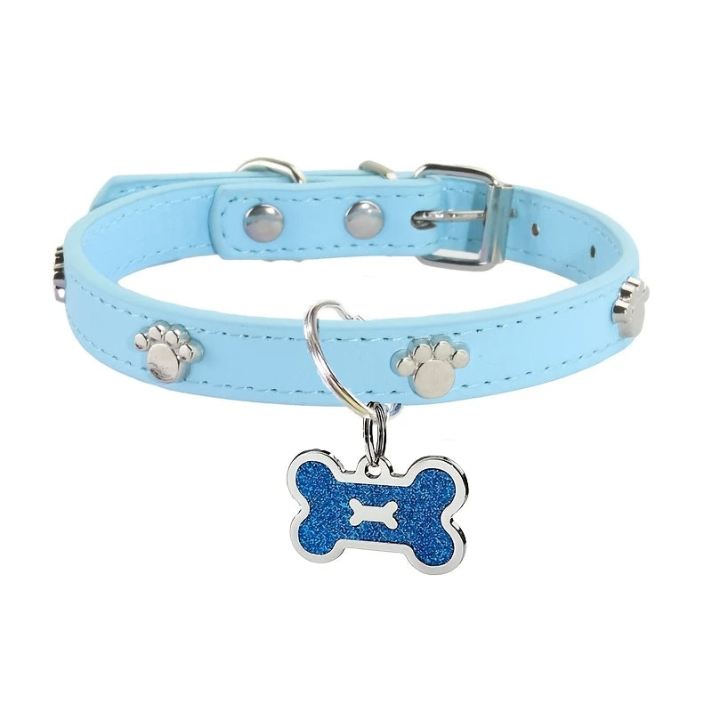 Light blue leather collar with silver hardware and a blue glitter bone tag shaped like a paw print.