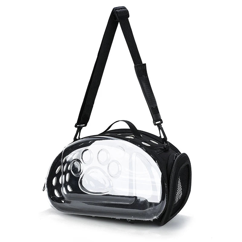 A black transparent foldable pet travel carrier with a shoulder strap.