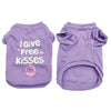 A pair of lavender cotton dog vests featuring the text I Give Free Kisses