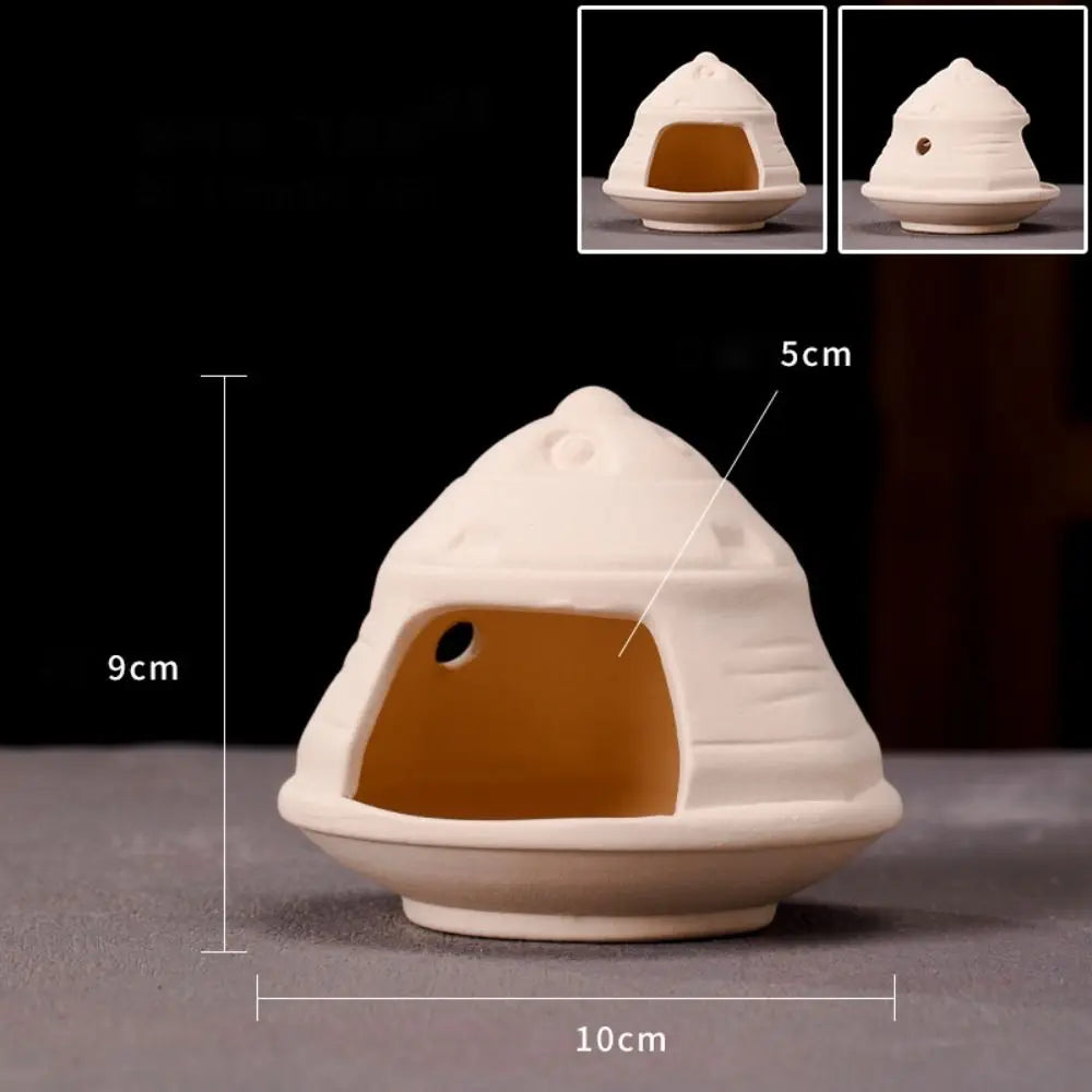 A white ceramic aquarium shrimp hideaway cave with an entrance, shown in various angles and dimensions.