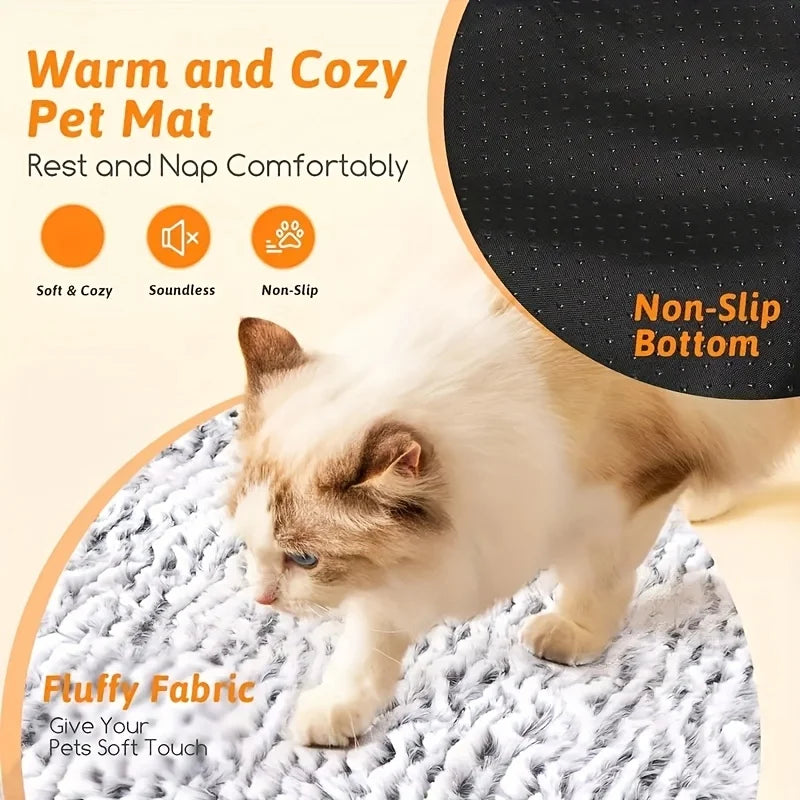 A fluffy white and brown cat is resting on a soft, non-slip pet mat.