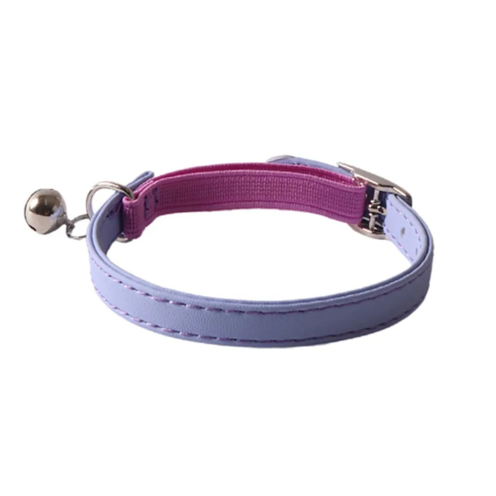 A pink and light purple adjustable cat collar with a bell made of soft PU leather and elastic webbing.