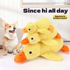 A yellow plush toy shaped like a duck is shown next to a small dog, designed to produce sound.