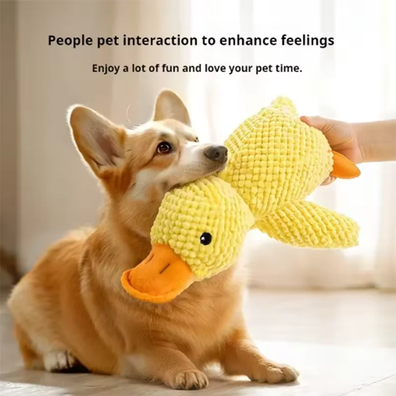 A dog is interacting with a yellow plush duck toy.