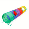 A colorful interactive cat play set featuring a collapsible tunnel, feather teaser wand, and crinkle balls.