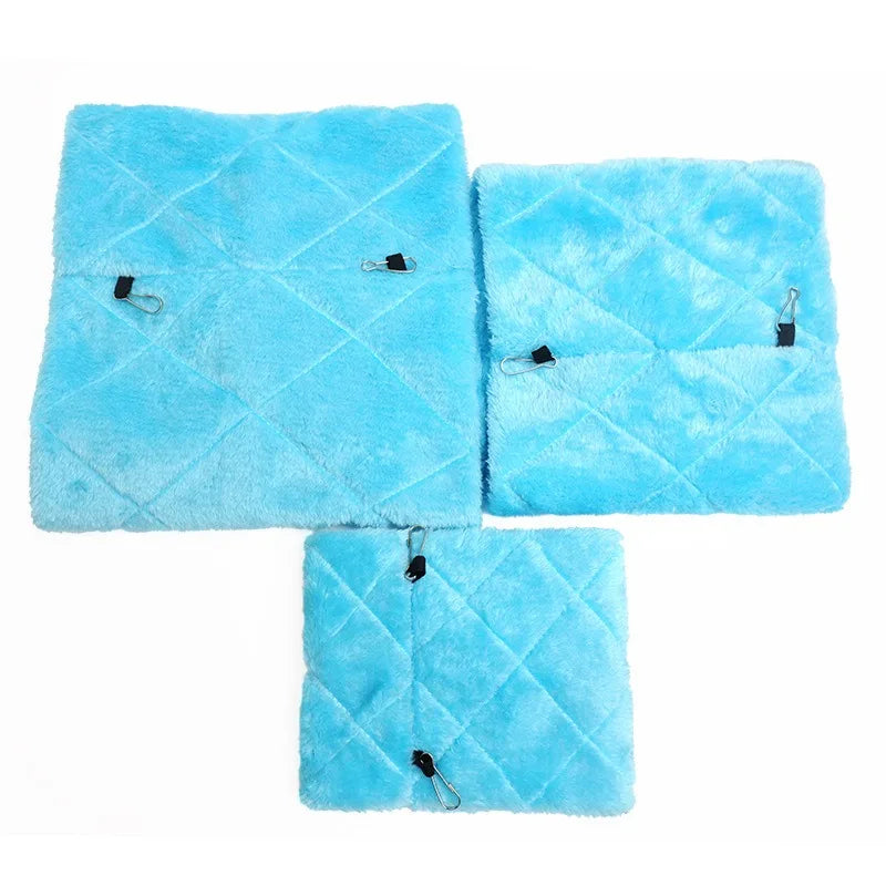 Three square blue plush hanging bird hammock beds with silver hooks