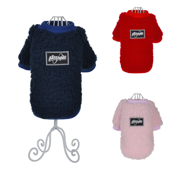 Three cozy fleece dog sweatshirts in navy blue, red, and pink displayed on hangers.