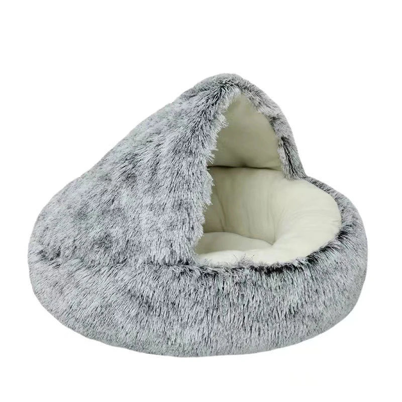 A round, gray faux fur pet bed with a removable cover shown from the opening.