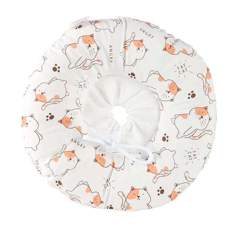 A white soft cotton recovery collar for dogs and cats featuring various angry, fat cat-themed patterns.