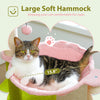 A tabby cat relaxing in a pink soft hammock designed for naps.