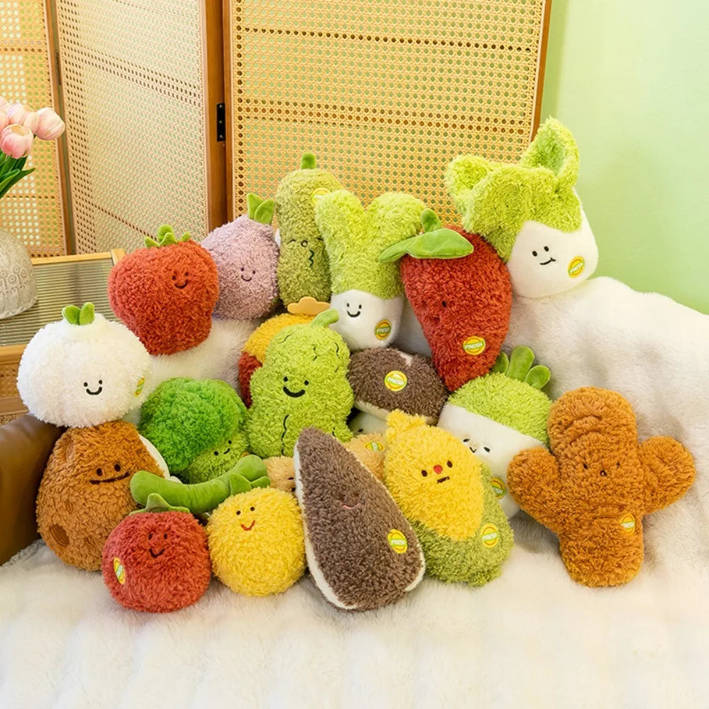 A collection of soft plush vegetable dolls in various colors including strawberry, broccoli, and mushroom resting on a white 