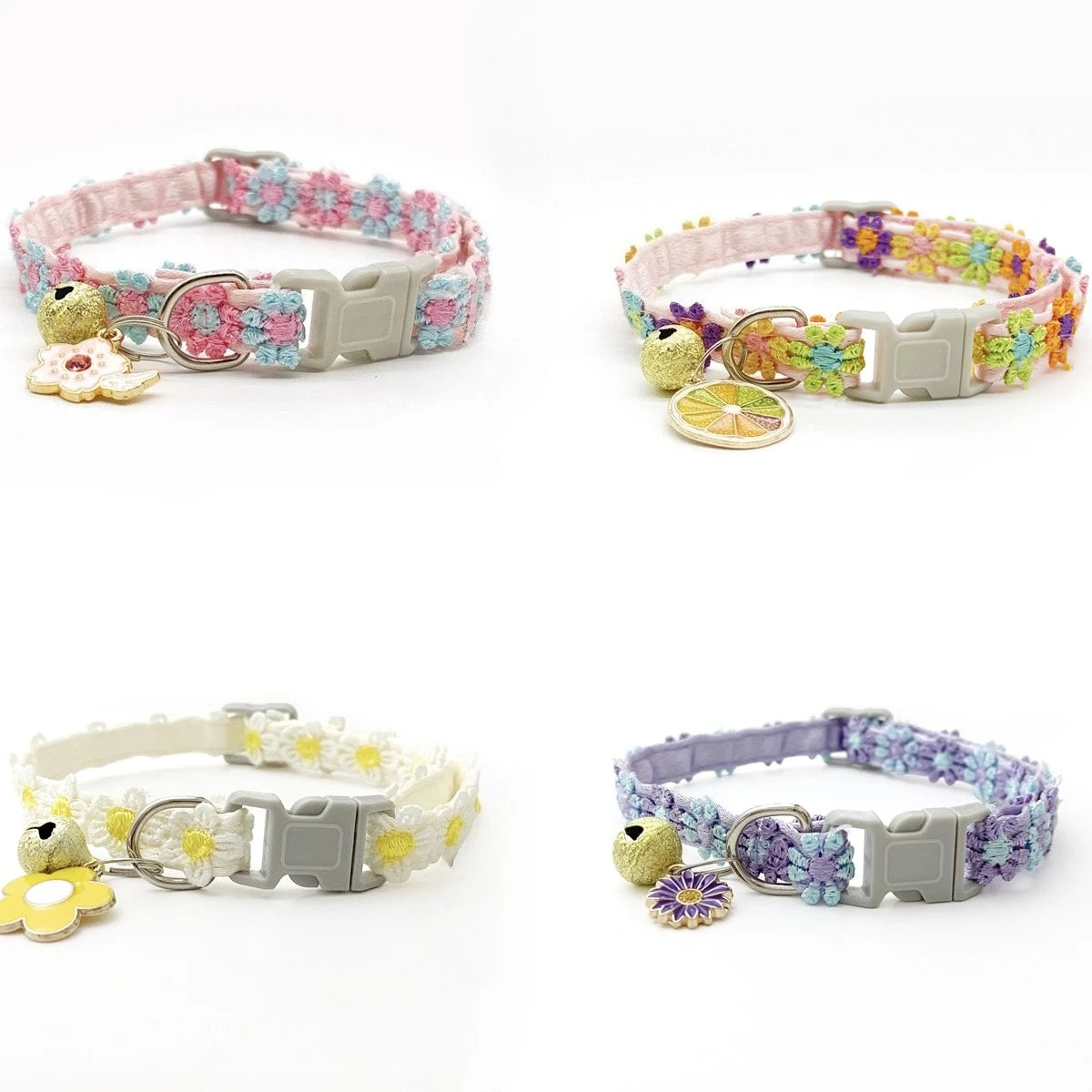 A colorful lace flower cat collar with a silver buckle and bell, featuring pink, purple, and yellow floral patterns.
