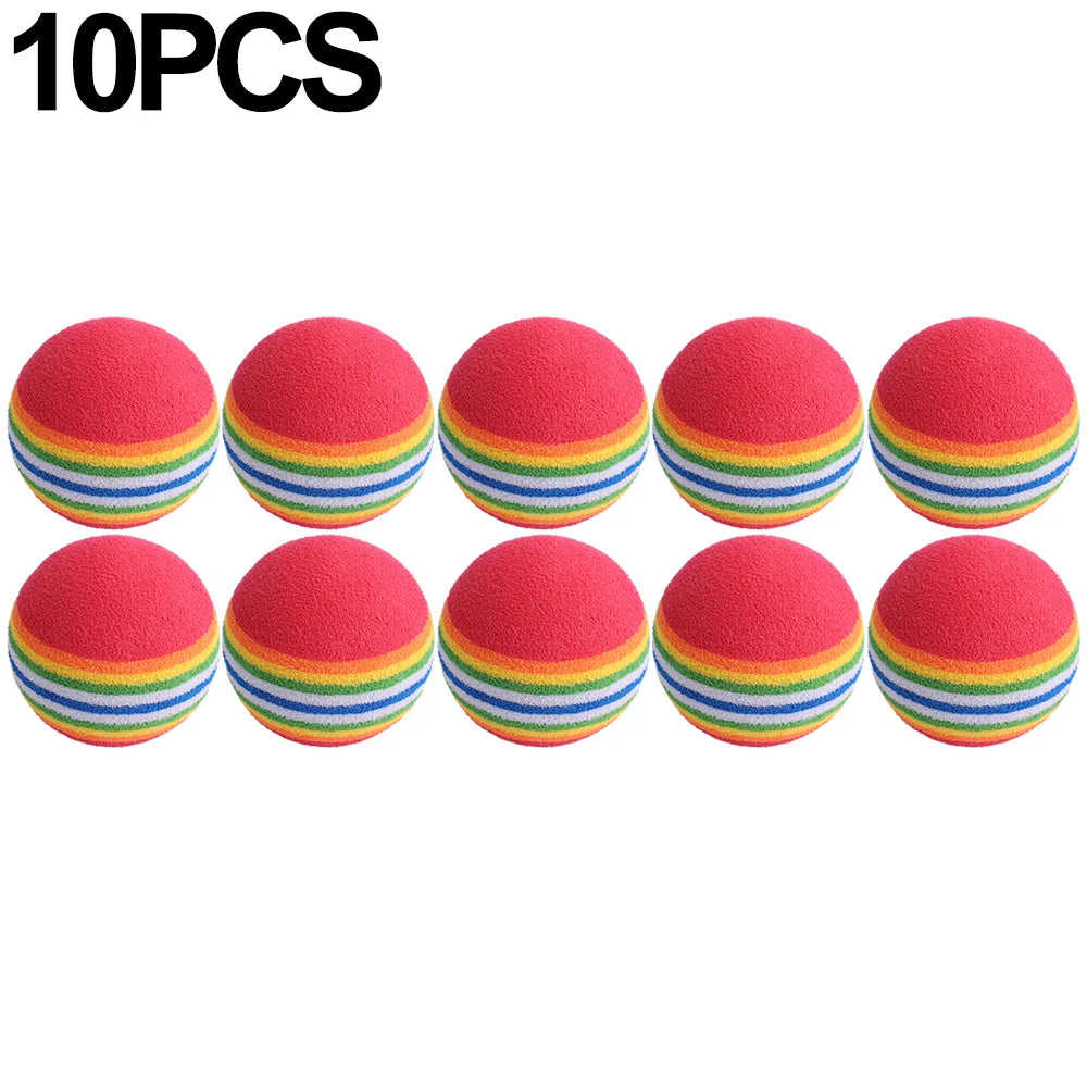 Ten rainbow colored EVA rattle balls arranged in a row.