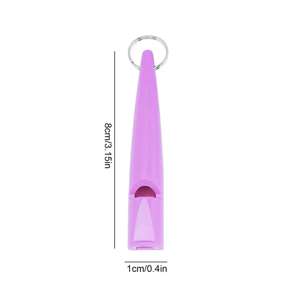 Sifflet de dressage pour chien violet avec boucle métallique et design pointu.