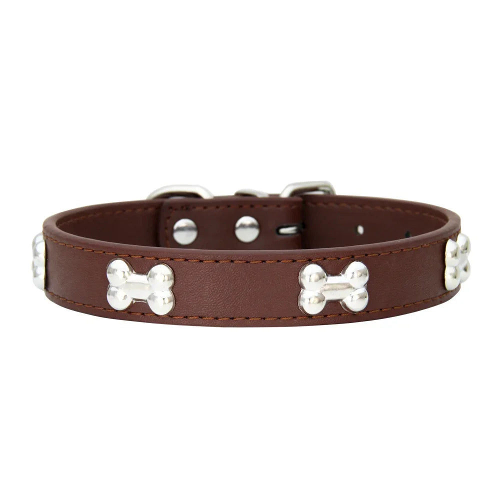 Brown leather dog collar with silver bone rivets and padded neck strap.