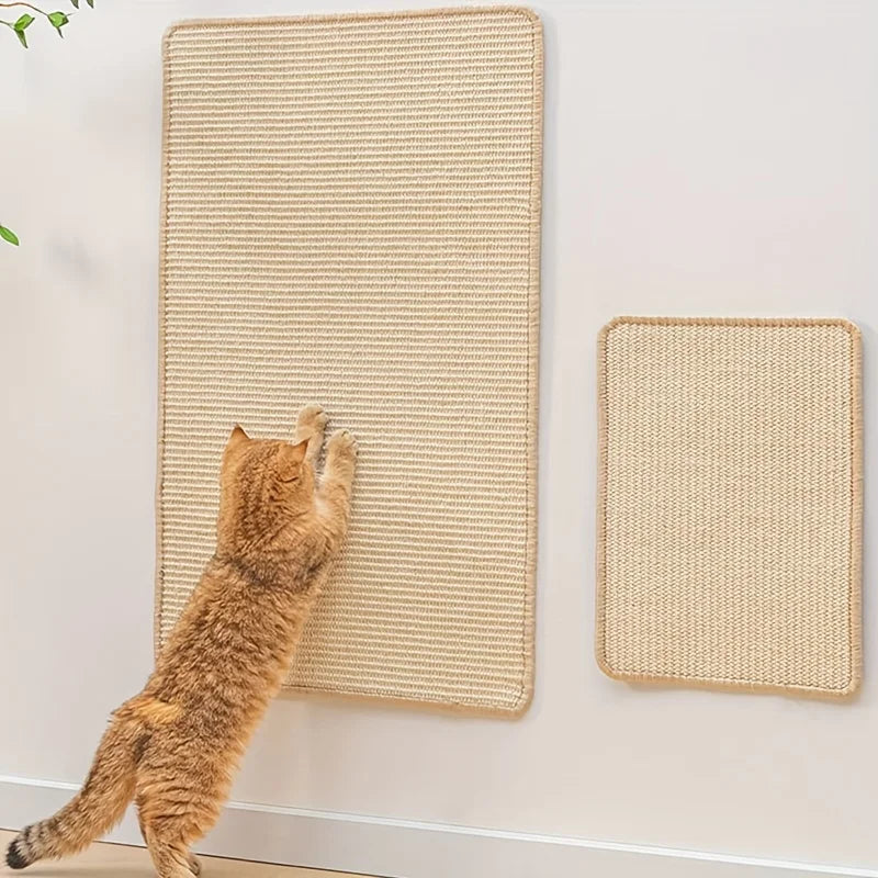 A fluffy orange cat is interacting with a wall-mounted sisal scratching mat on a white wall.