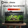 حوض سمك ذكي، موديل MYG100، معروض في حوض زجاجي مليء بالنباتات والصخور المائية الوفيرة.