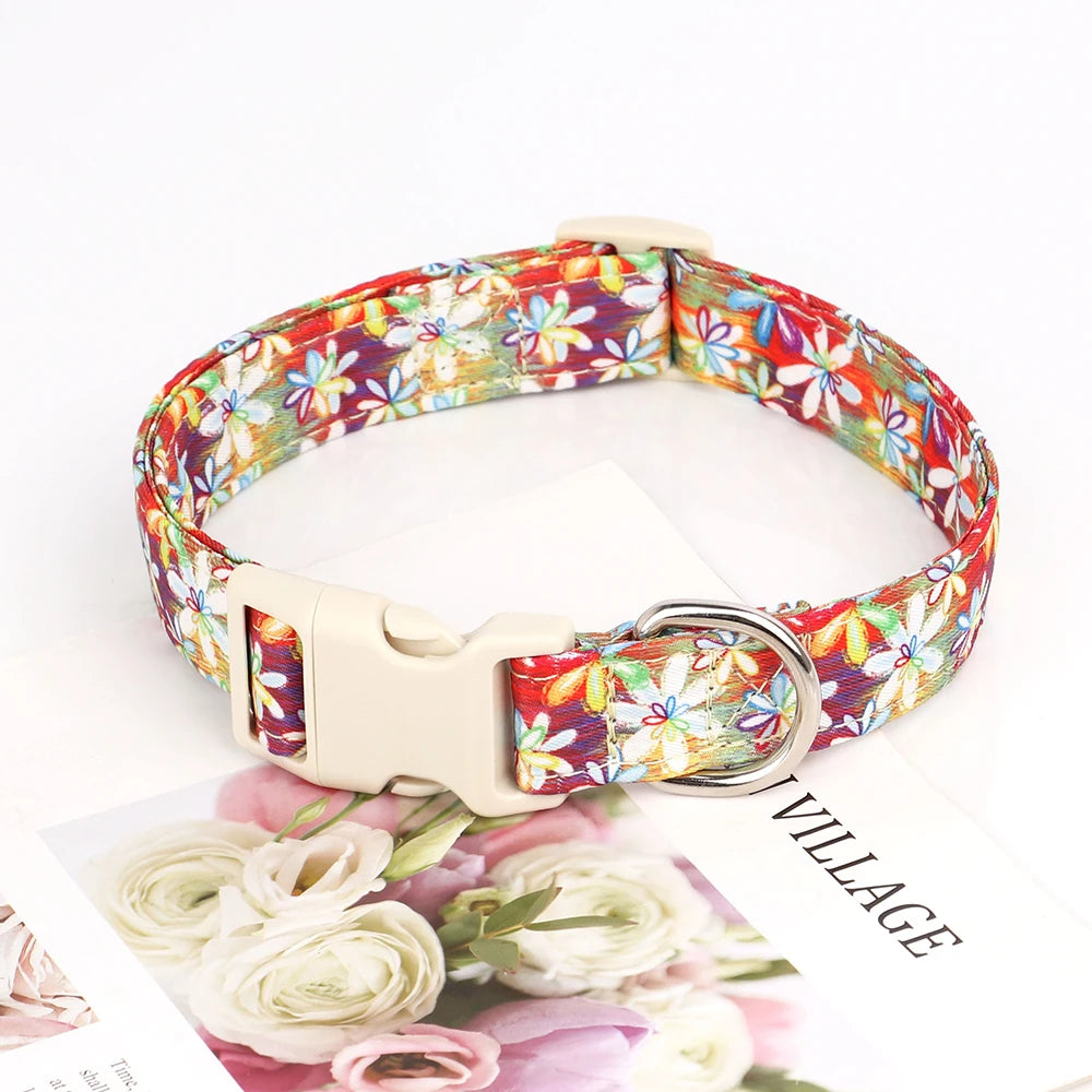 Adjustable nylon dog collar featuring a colorful bee and flower print on the strap.