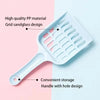 White plastic cat litter scoop with a grid design and a handle with holes