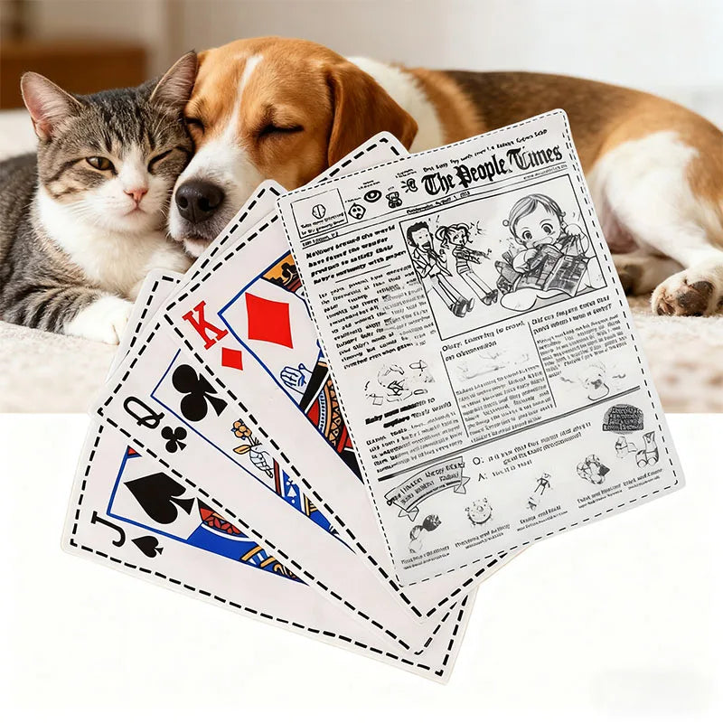 A stack of newspaper-themed plush dog toys featuring illustrations and text, next to two dogs.