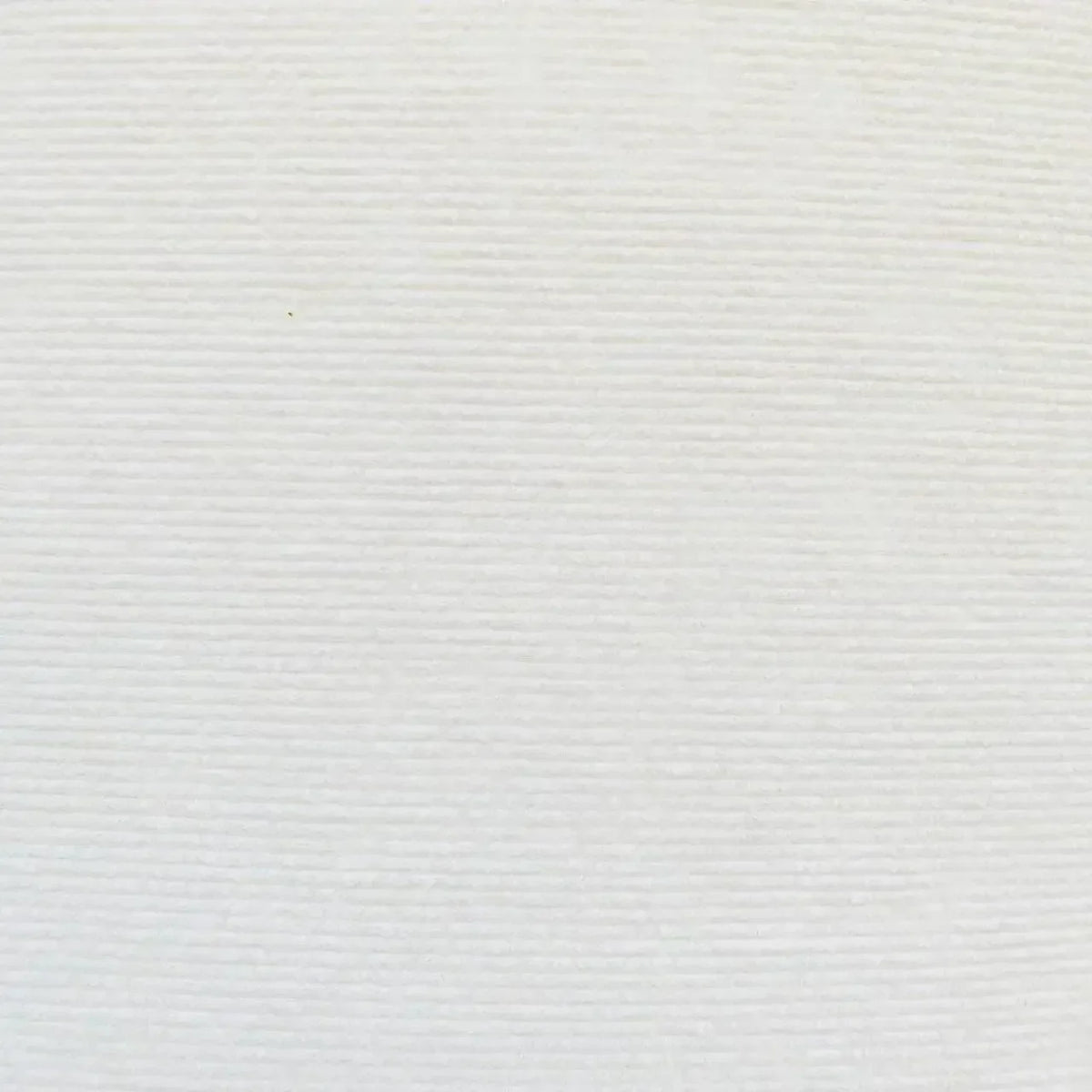 A close-up view of a white self-adhesive trimmable cat scratch pad for furniture and wall protection.